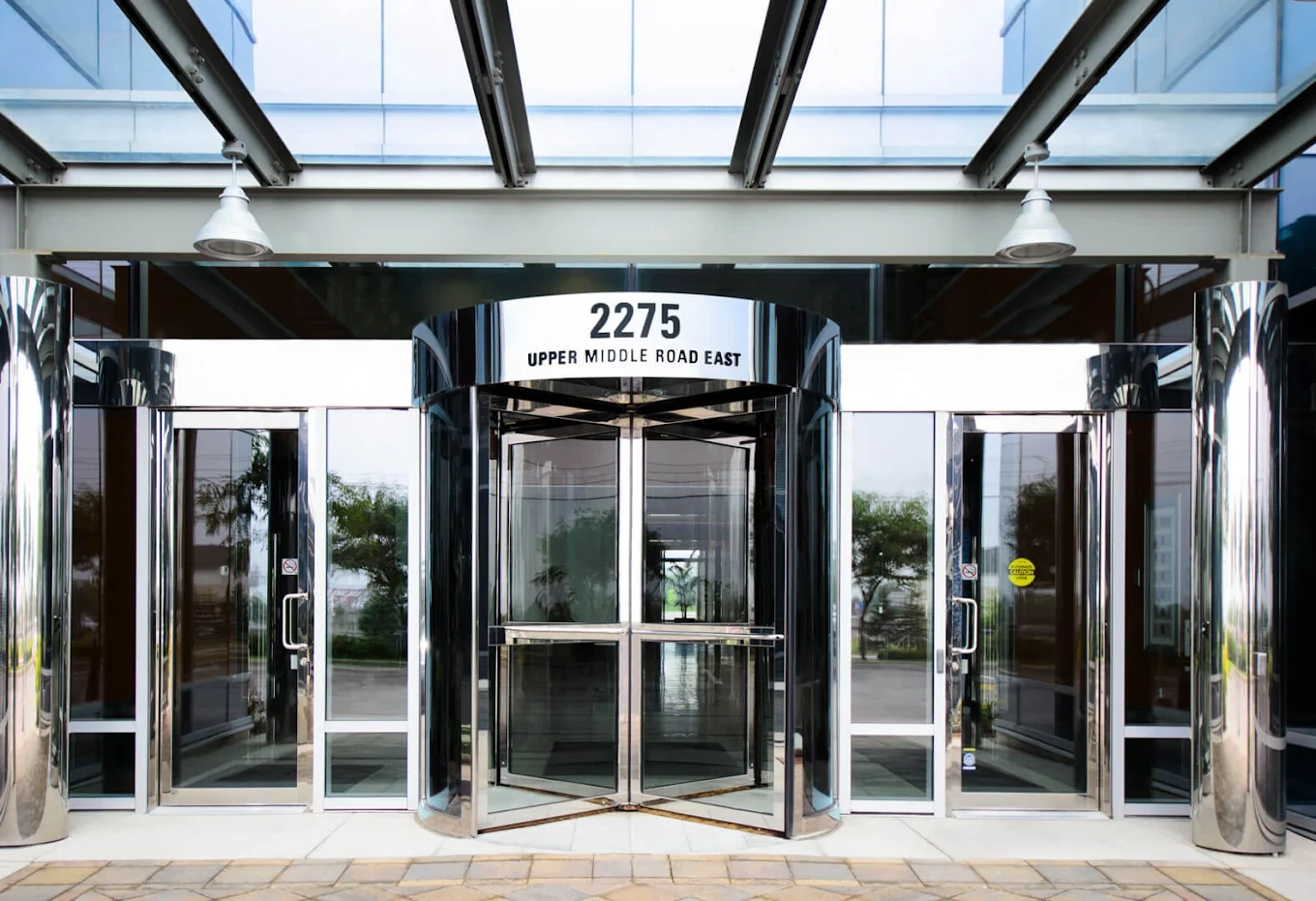 Front entrance of 2275 Upper Middle Road East in Oakville, with the building number above the doors
